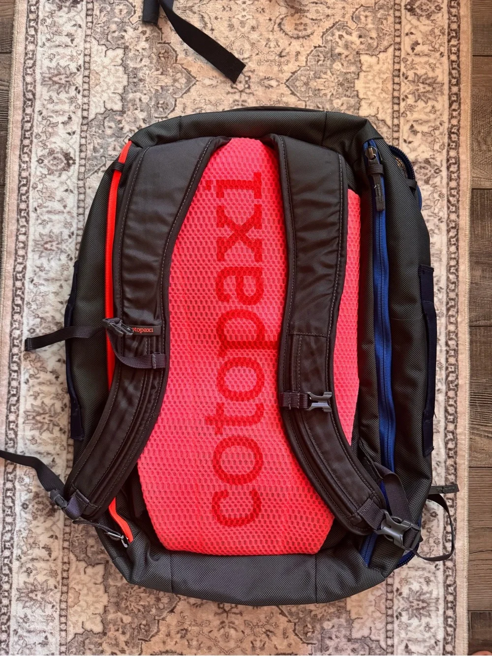cotopaxi Light Blue Backpack with Red, Orange, Teal & Purple Accents